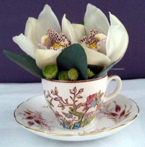 Orchid teacup display by Shrinking Violet